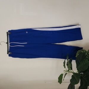 Under Armor blue track pants, button ankles, drawstring elastic waist, medium
